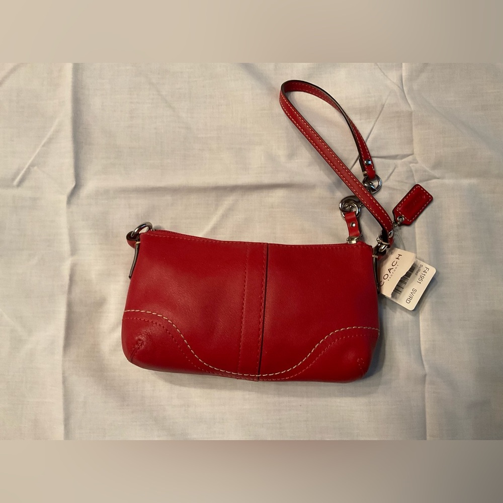 Coach red leather wristlet.